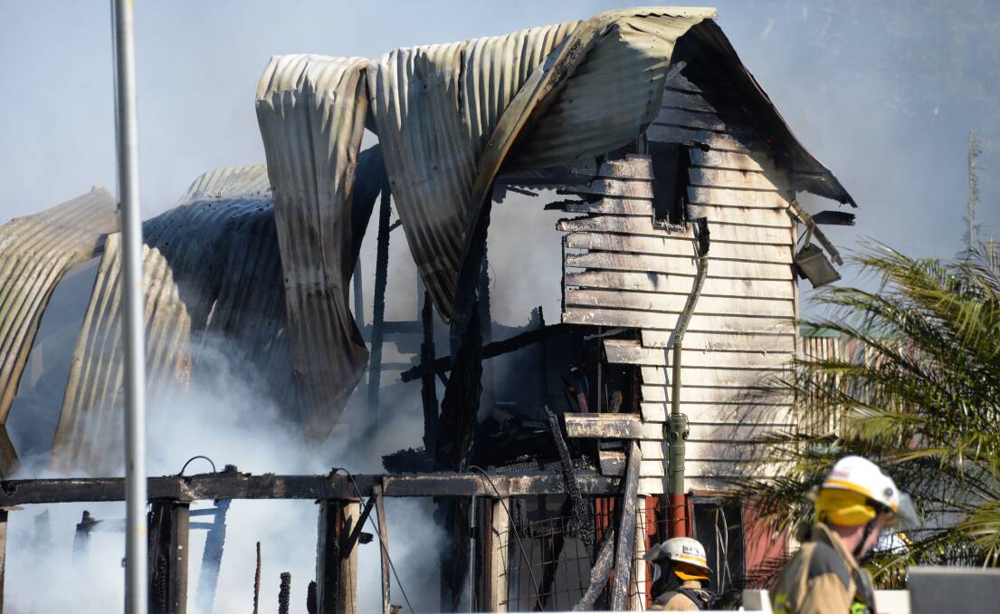 SERIOUS DAMAGE: Fire destroyed most of a two-storey Queenslander home at Redland Bay this morning. Photo: Jordan Crick