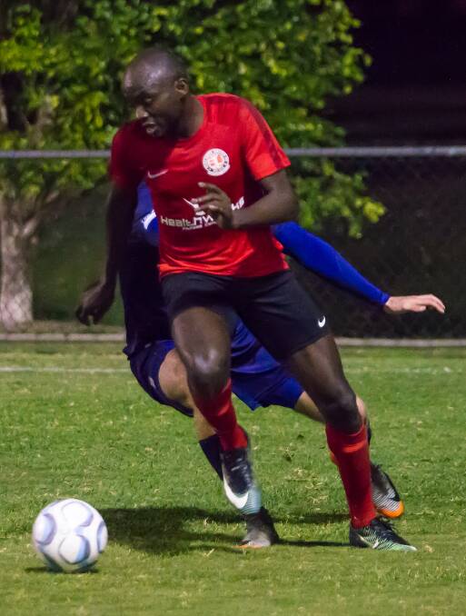 ON ATTACK: Uche Iheruome moves the ball upfield for Redlands United during the Red Devils' NPL clash against Olympic FC last Friday.  Picture: Ray Gardner


