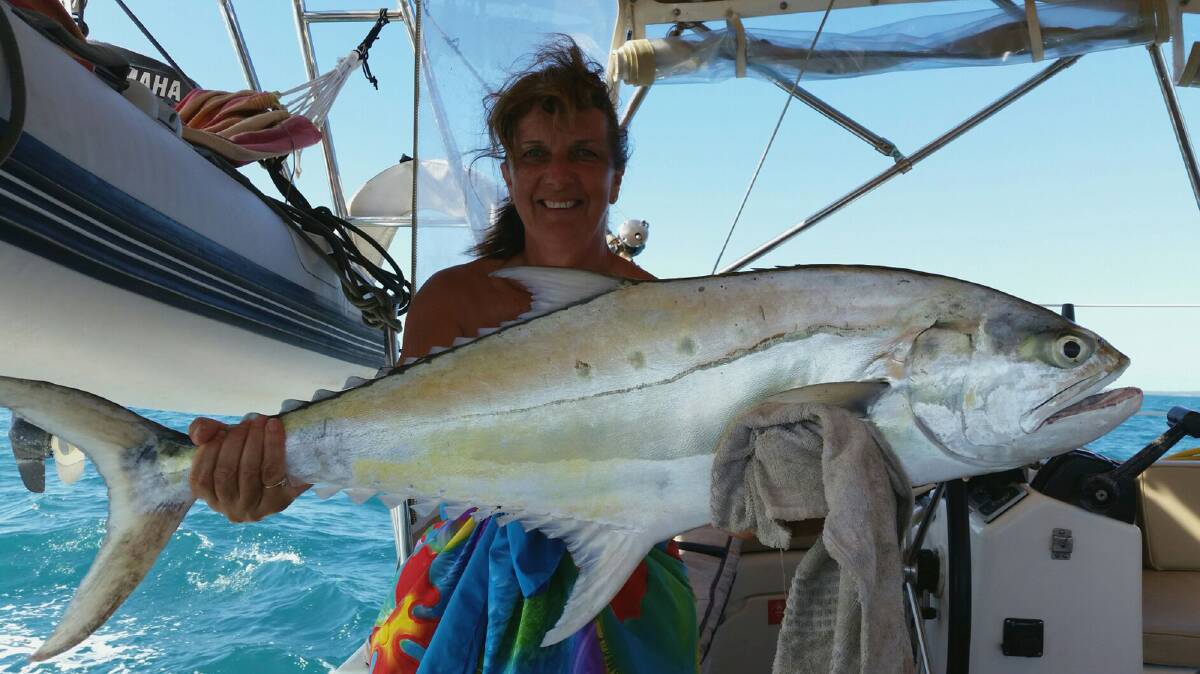 Sue Bates happy with her queenfish caught just south of Mackay.
