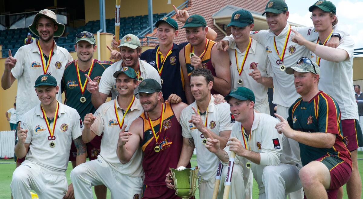 CHAMPIONS: Redlands Tigers First Grade team celebrate winning the Queensland Premier Cricket – myFootDr First Grade competition Cam Battersby Cup. Picture: Alan Minifie
