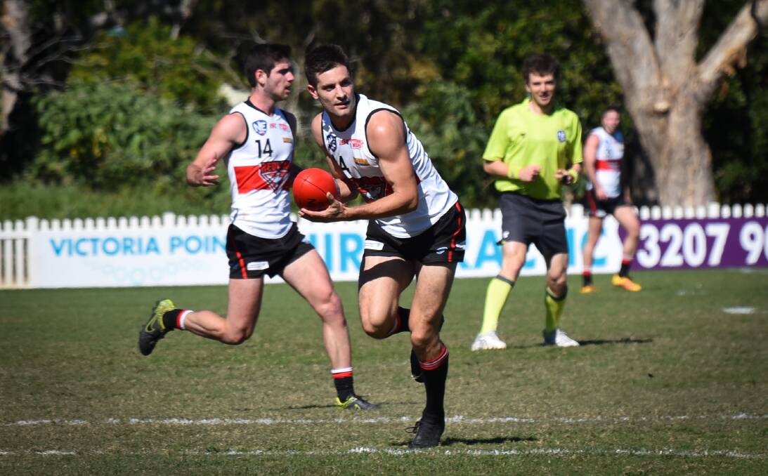 GOOD WORK: Tom Salter played his best game of the season through the midfield for Redland Bombers on Saturday. Picture: Highflyer Images