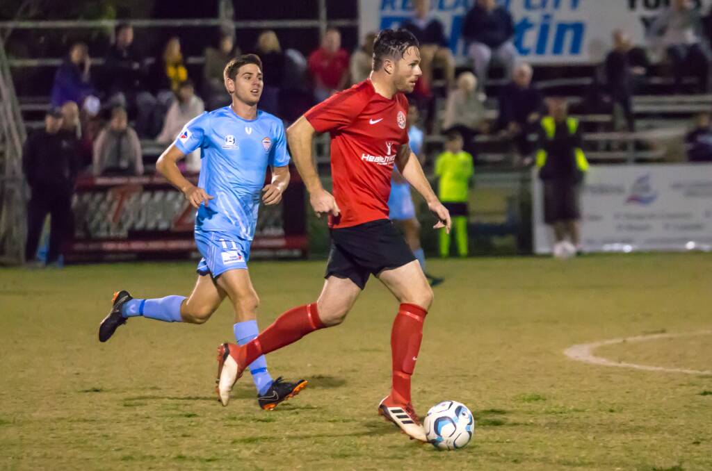 Bobby Irving in action for the Red Devils against Cairns FC in their National Premier League match at the Cleveland Showgrounds Saturday evening.  Picture: Ray Gardner