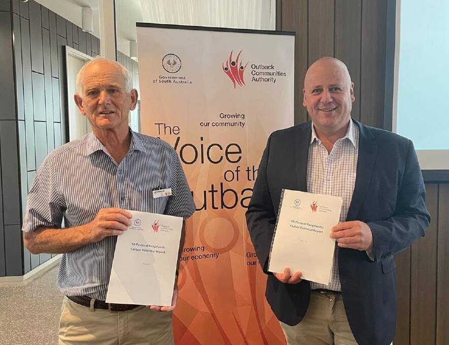 POTENTIAL EXPLORED: A report, held by Outback Communities Authority chair Bill McIntosh and Primary Industries and Regional Development Minister David Basham, shows there are millions of dollars of potential for carbon farming in the top half of SA.