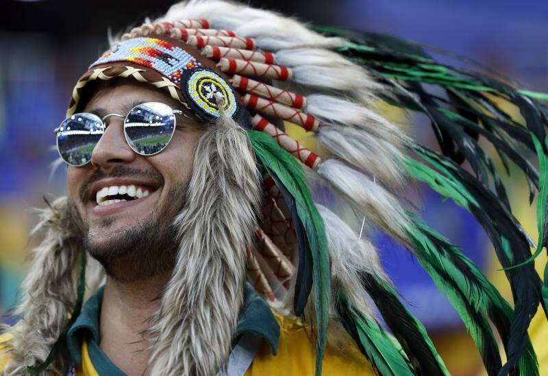 A Brazil supporter waits for the start of the group E match between Serbia and Brazil. Photo: AP Photo/Rebecca Blackwell