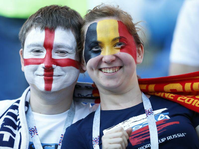 Fans of Belgium and England wait the start of the group G match between England and Belgium. Photo: AP Photo/Hassan Ammar