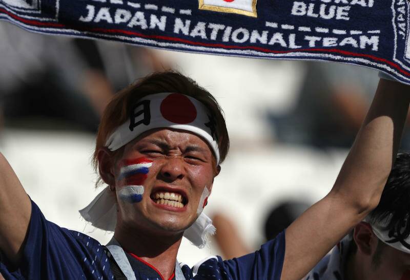 A Japanese supporter reacts before the group H match between Japan and Poland. Photo: AP Photo/Darko Vojinovic