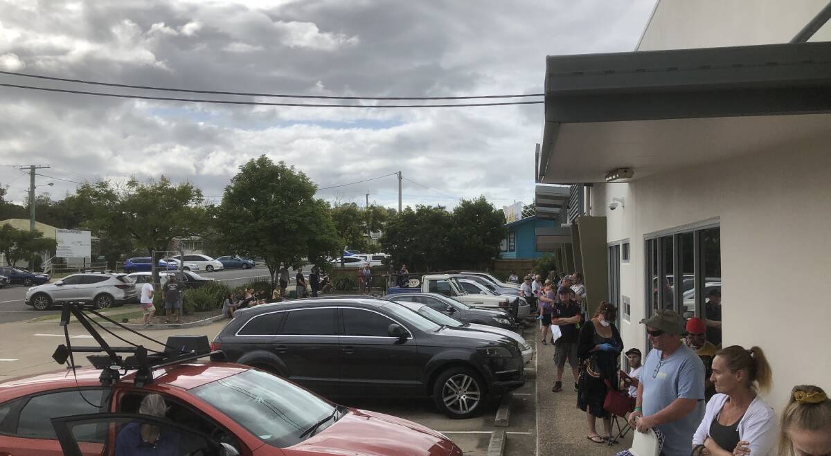THREE-HOUR WAIT: Residents outside Centrelink this morning. Photo: Jeff McConnell.