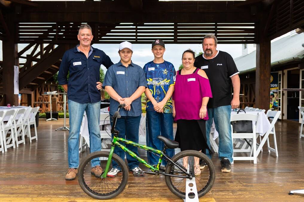TRACTION: Mentor Tim Wakefield with Mitchell Browne and his family at the Scenic Rim thank you dinner held at Polo Alsace. Photo: provided