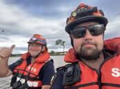 ACTION: Flood boat operators Kevin Martin and Adam Dorricott worked on very little sleep for two days. Photo: Supplied