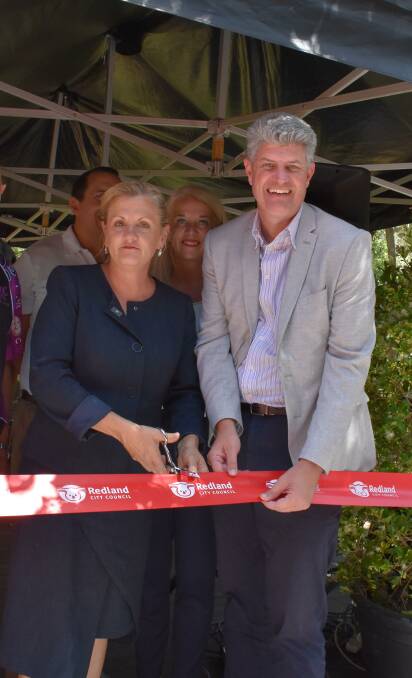 GREEN FINGERS: Mayor Karen Williams and Local Government Minister Stirling Hinchliffe cut the ribbon at the reopening of the eco centre.