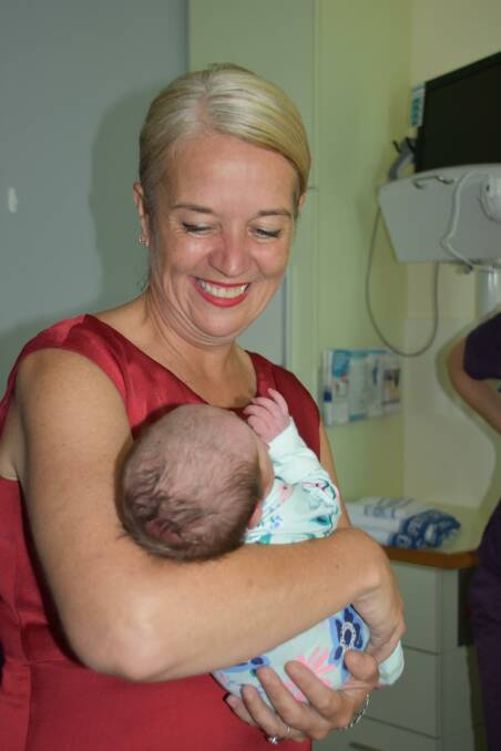 ROCK A BYE BABY: Redlands MP Kim Richards cradles baby Ava Christodoulou during a tour of the new birthing unit at Redland Hospital.
