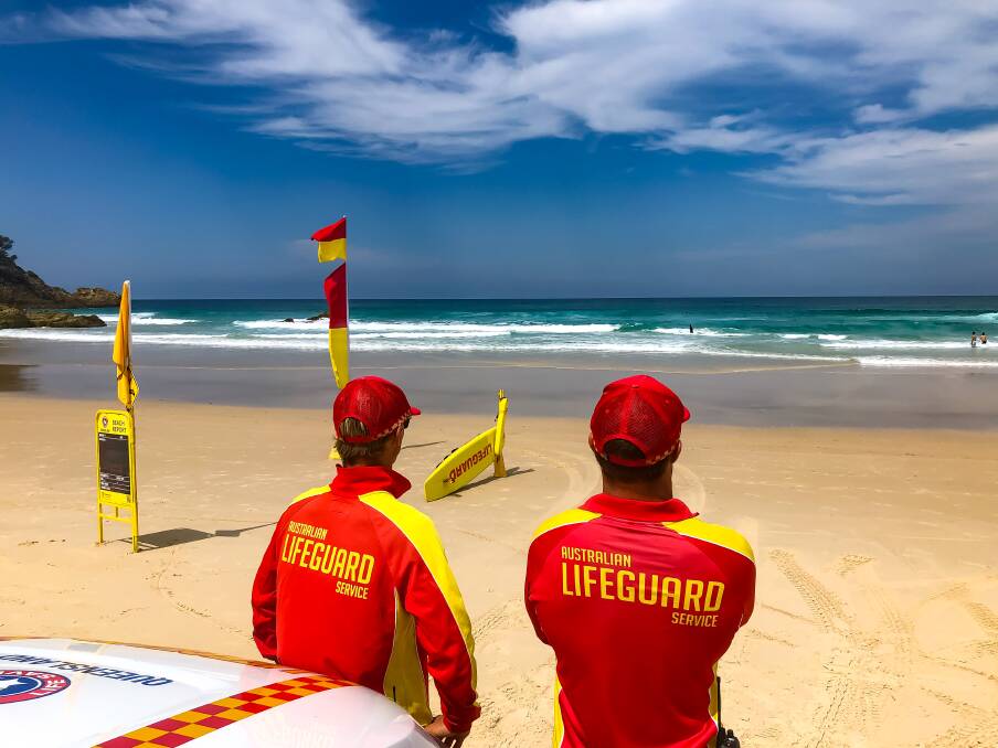 SUMMER: Lifeguards on Cylinder Beach, one of the most popular swimming spots on North Stradbroke Island.
