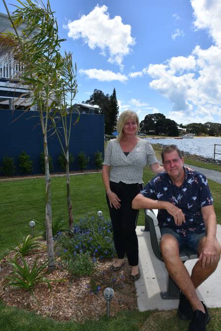 GREEN FINGERS: Victoria Point couple Lisa and Gary Bylund in the garden outside their home.