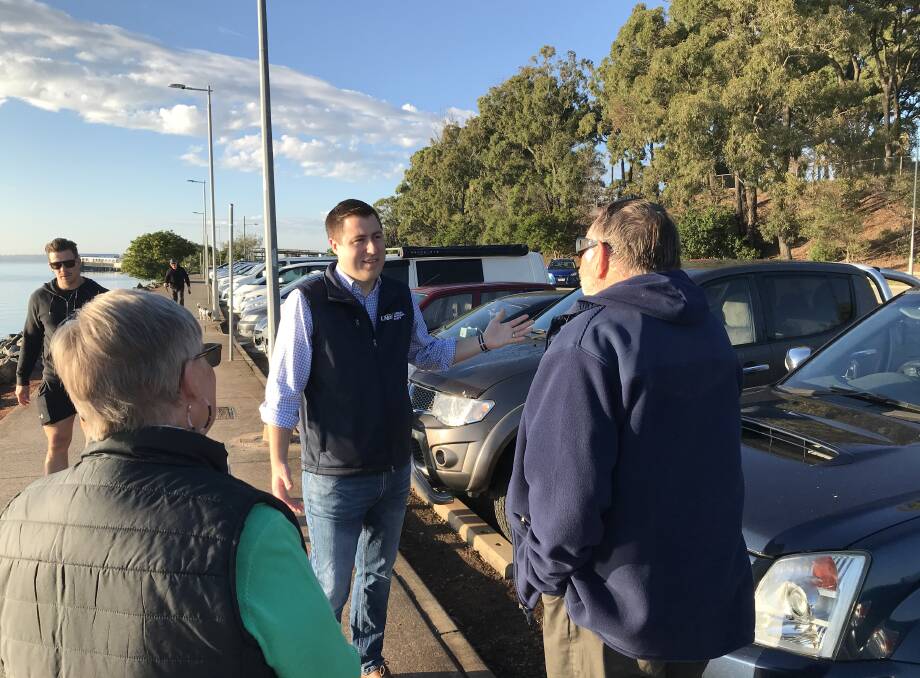 SECURITY: Henry Pike talking with locals about their concerns with the Victoria Point jetty car park.