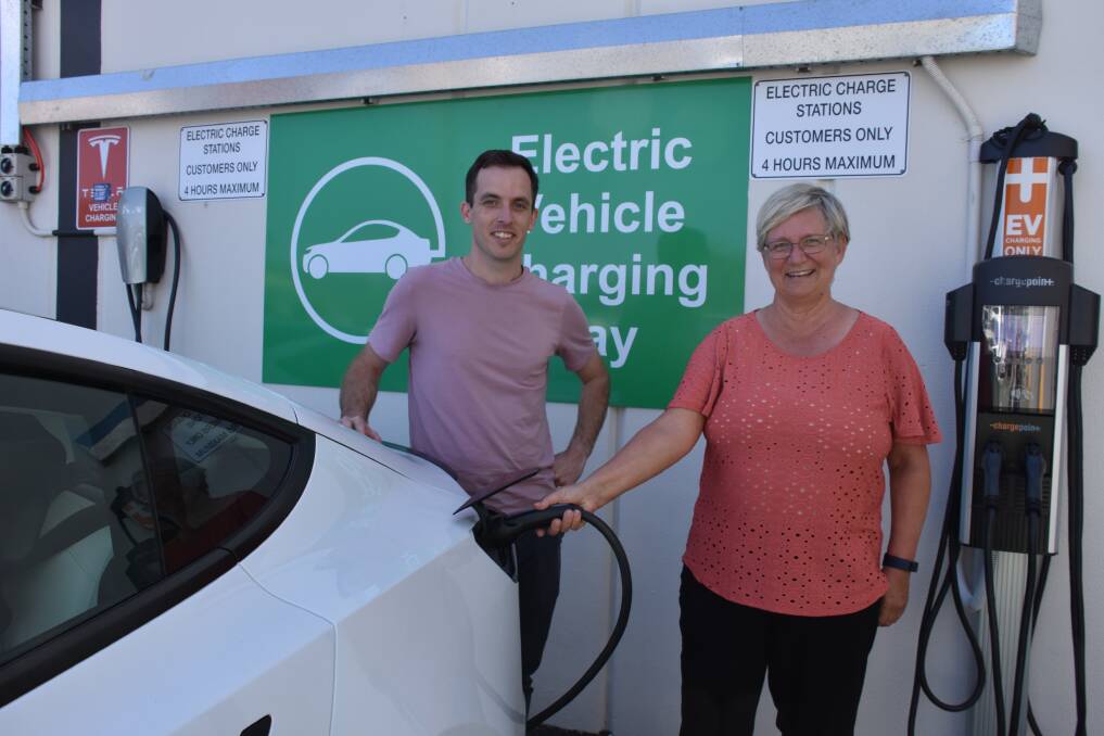 FILL UP: Angus McLauchlan and Judy Broadhurst plug in at the electric car charging station at Cleveland Central shopping centre. 