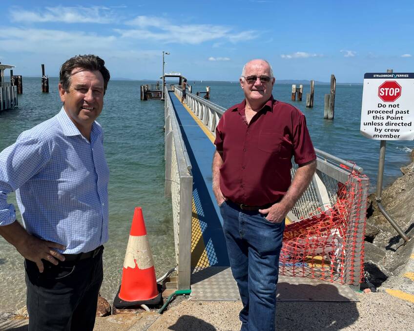 JETTY WIN: Simon Walker and Oodgeroo MP Mark Robinson at the Harold Walker Jetty. Mr Walker said his father had worked around the clock as owner and operator of the Dunwich Ferry Service.
