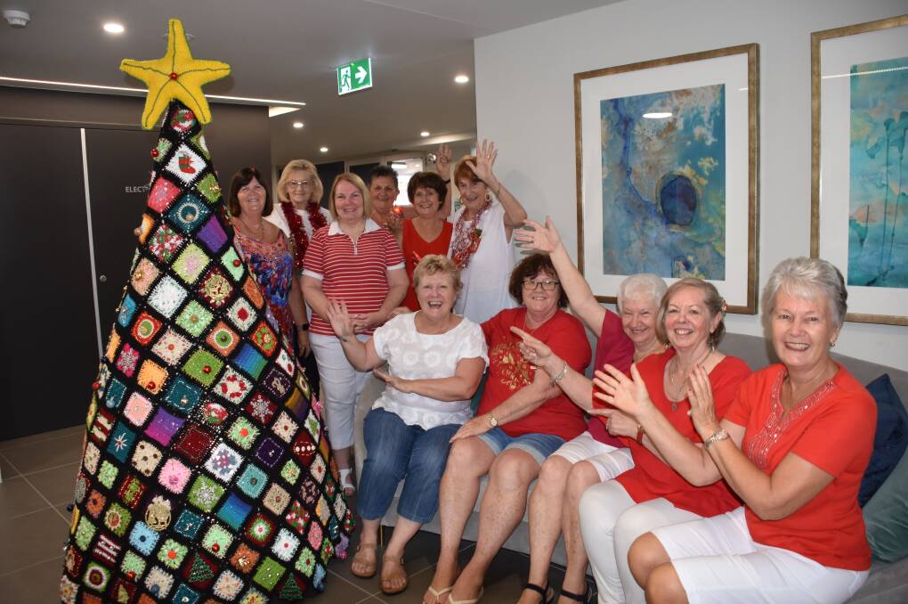 TWINKLE TWINKLE: The craft group from Reflections Cleveland apartment block with the colourful crochet Christmas tree.