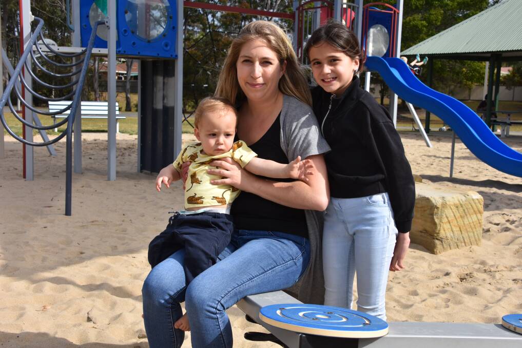 BORDER BATTLES: Thornlands mum Verena Nothling with her son Avery, 1, and Lilly, 9. Her parents in Germany are yet to meet their grandson.