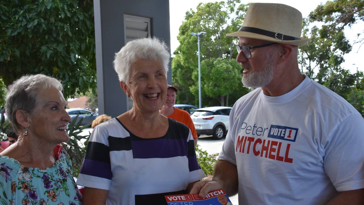 AT THE POLLS: Shirley Kaye and Hilary Forshaw chat to Scott Norup at the Cleveland voting station at the Baptist Church.
