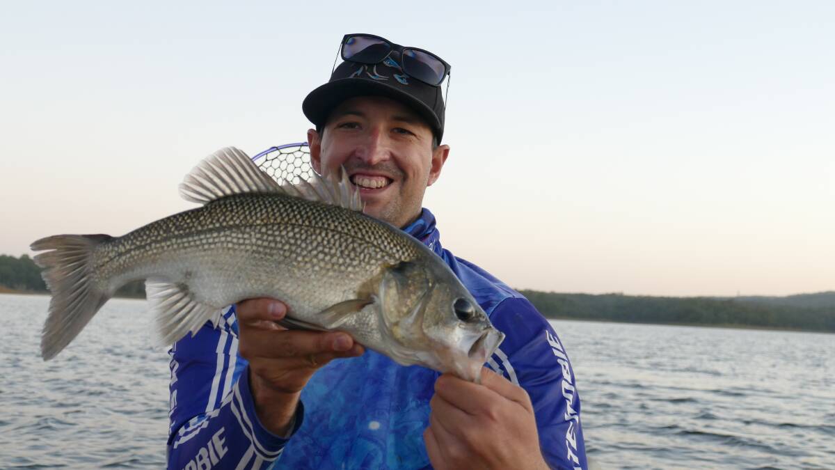 HOOKED: Lee Edwards with his bass caught at Lake Samsonvale.