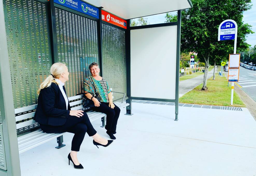 EN ROUTE: Redlands MP Kim Richards chats to Pam Leece at a Redlands bus shelter.