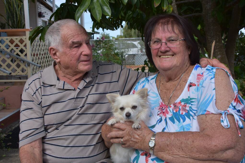 DEVOTED: Barry and Joy Bright with their loyal companion Cindy. The Birkdale couple celebrate their diamond wedding anniversary on October 15.