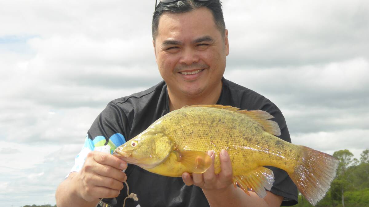 TIGHT LINES: Tai Bui with a yellow belly caught in one of the local damn impoundments.