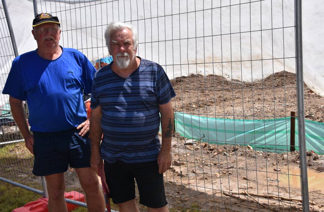 QUESTIONS: Merv Mortensen and David Brewer outside the property under construction in Gardenia Drive, Birkdale. 