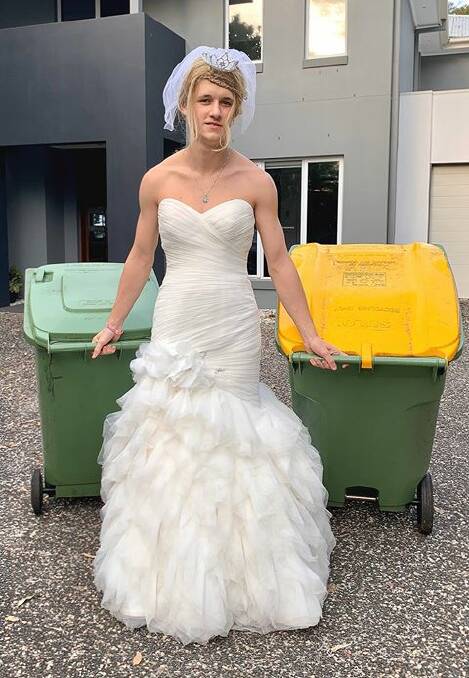 WEDDING BELLE: Flynn Clifford-Smith walks down the aisle...oops, the driveway to put out the rubbish bins.