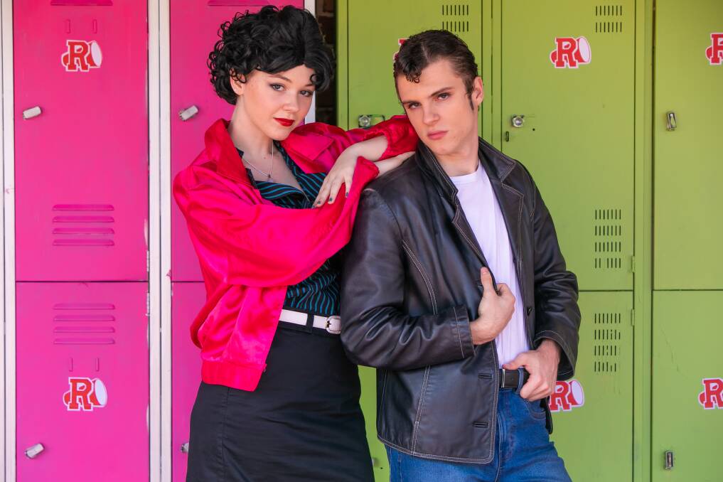 HOUND DOG: Betty Rizzo played by Grace Garnett and Marcus Henville aka Kenickie strike a pose at a dress rehearsal for Ormiston College's production of Grease.