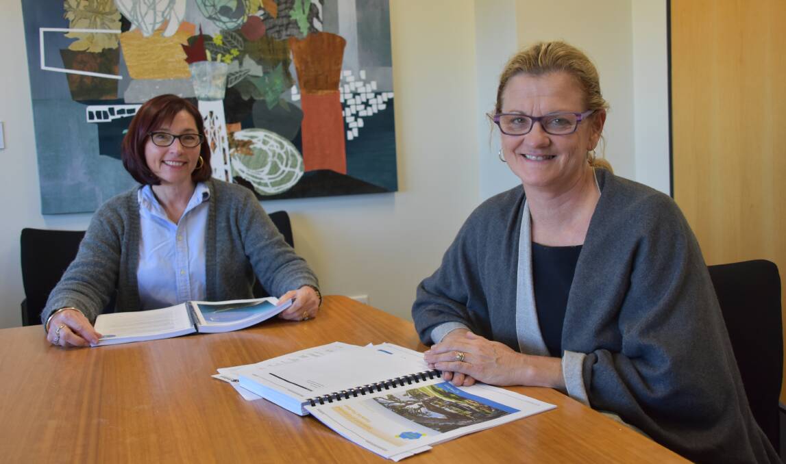 FUNDS: Mayor Karen Wiilliams and deputy mayor Julie Talty look over the Redlands Coast Council budget for 2020-21.
