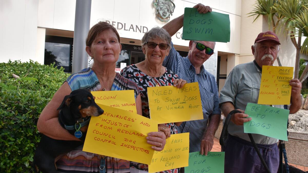 FREE THE DOGS: Jenny Larsen with Cashew, Caroline and John Price and Lynden Christophers outside the Redland City Council offices.