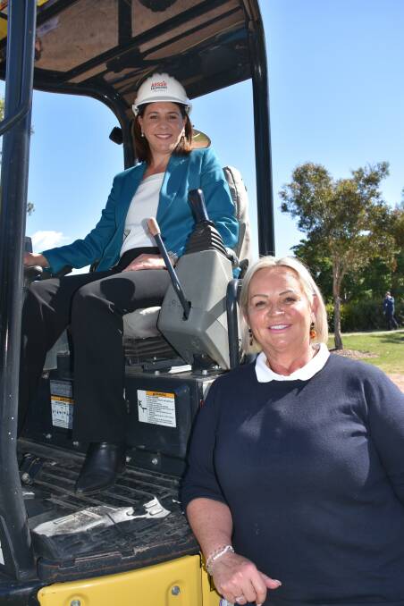 FIX: LNP leader Deb Frecklington and local business owner Leanne Sullivan from Aussie Excavators at the site on Cleveland-Redland Bay Road in Thornlands.