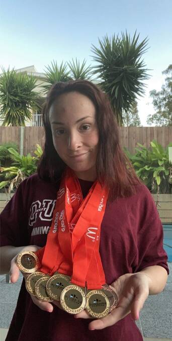 SPLASH: Mount Cotton Paralympian Paige Leonhardt with some of her medals.