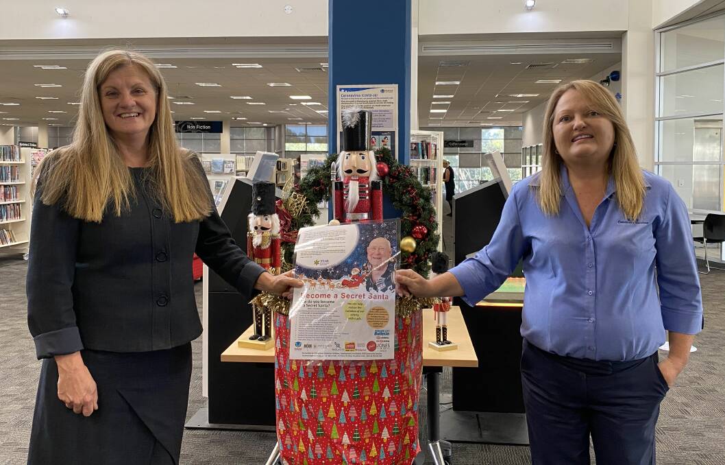 GIFT DROP: Redland City Mayor Karen Williams and STAR Community Services general manager Patsy Wilshire at Cleveland Library.