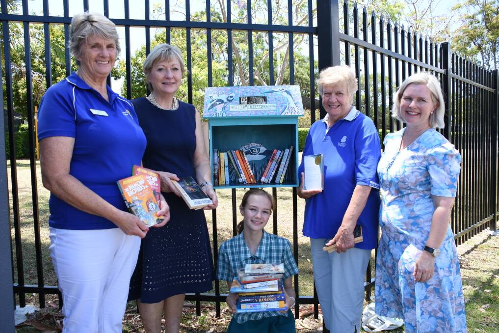 STREET READS: Wellington Manor resident Margie Spencer, Wellington Point State High School principal Dr Robyn Burton-Ree, student Bianca Langham with Judith Russell from the Children's Book Council of Australia and art teacher Tamara Beale.