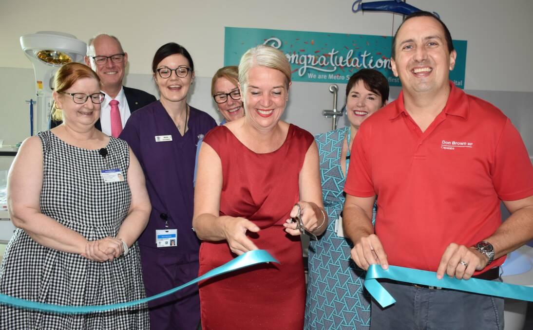 NEW BORN: Director of obstetrics and gynaecology Dr Wendy Dutton, executive director Dr Michael Cleary, midwife Annie Hampson, midwife consultant Trish Cottle and facility manager Susan Freiberg look on while Redlands MP Kim Richards and Capalaba MP Don Brown cut the ribbon to the new birthing unit.