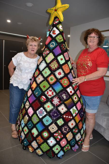 Sue Veijalainen and Christine Anderson with the crochet Christmas tree.