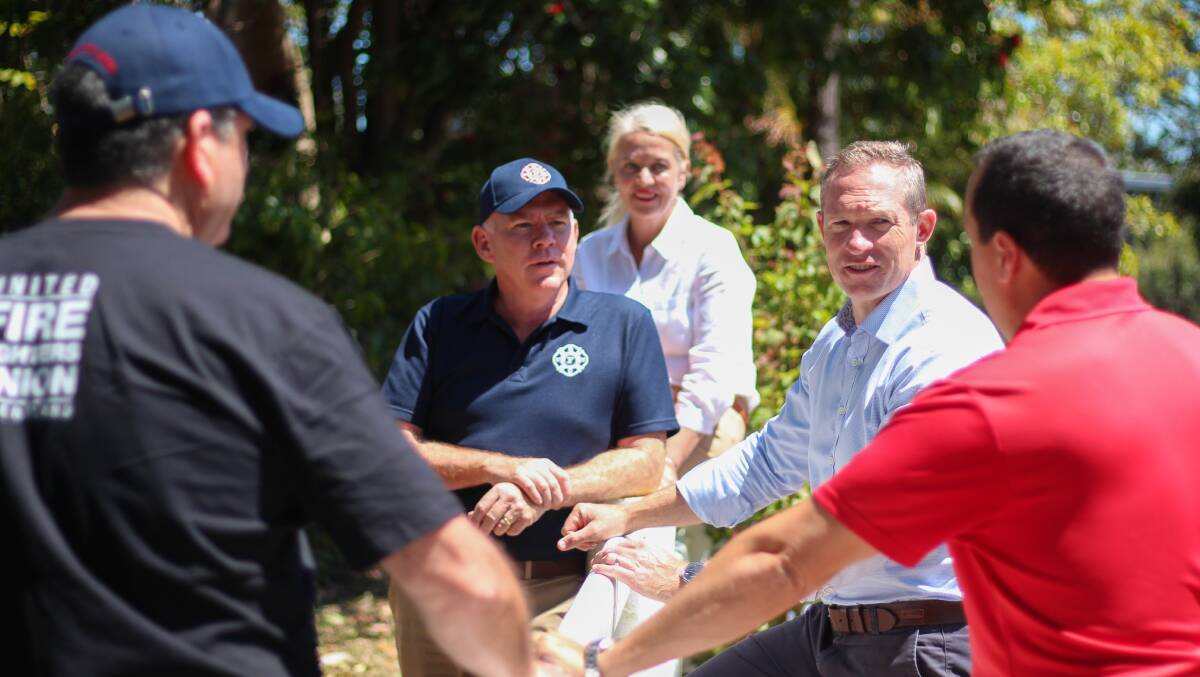 Springwood MP Mick de Brenni chats to Queensland secretary of the United Firefighters Union John Oliver with Capalaba MP Don Brown and Redlands MP Kim Richards.