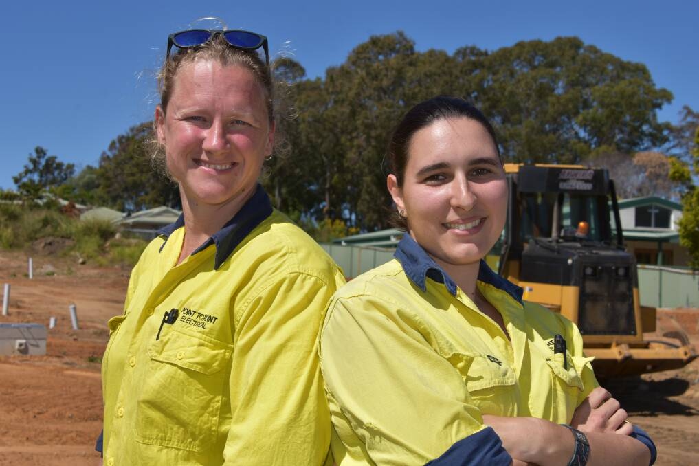 WIRED: Redlands electricians Jennifer Louw and Sarah Mulholland on the KubUnity site in Capalaba.
