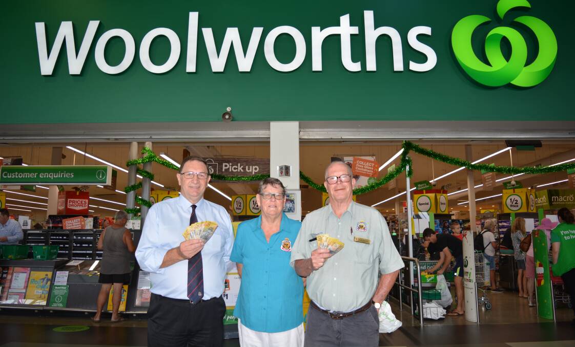 SANTA'S ELVES: Redlands RSL general manager Peter Harrison, President Alan Harcourt and his wife Linda Harcourt at Woolworths on Christmas Eve.