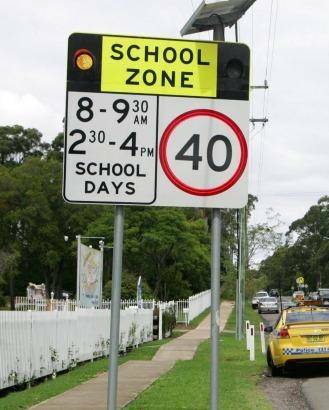 SLOW DOWN: The Transport and Main Roads Department's flashing school zone sign program recently celebrated the installation of its 1000th zone.