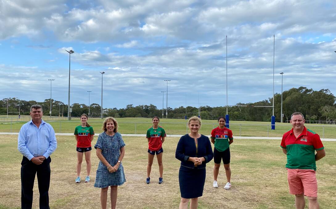 LET'S PLAY: Redlands Multi Sports Club President Colin Apps Colin, Cr Tracey Huges, Mayor Karen Williams and Redlands Rugby Union Club President Keith Taylor with some of the sportswomen at the Judy Holt Recreation Reserve