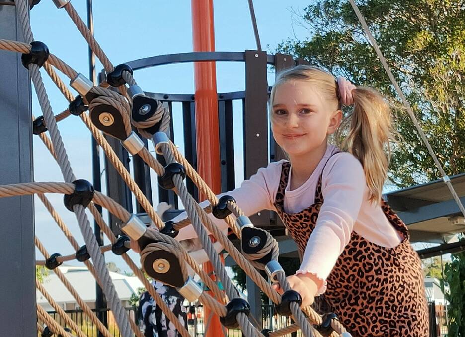 PLAYTIME: Taylor Bishop tries out the new equipment at the Thornlands Community Park.