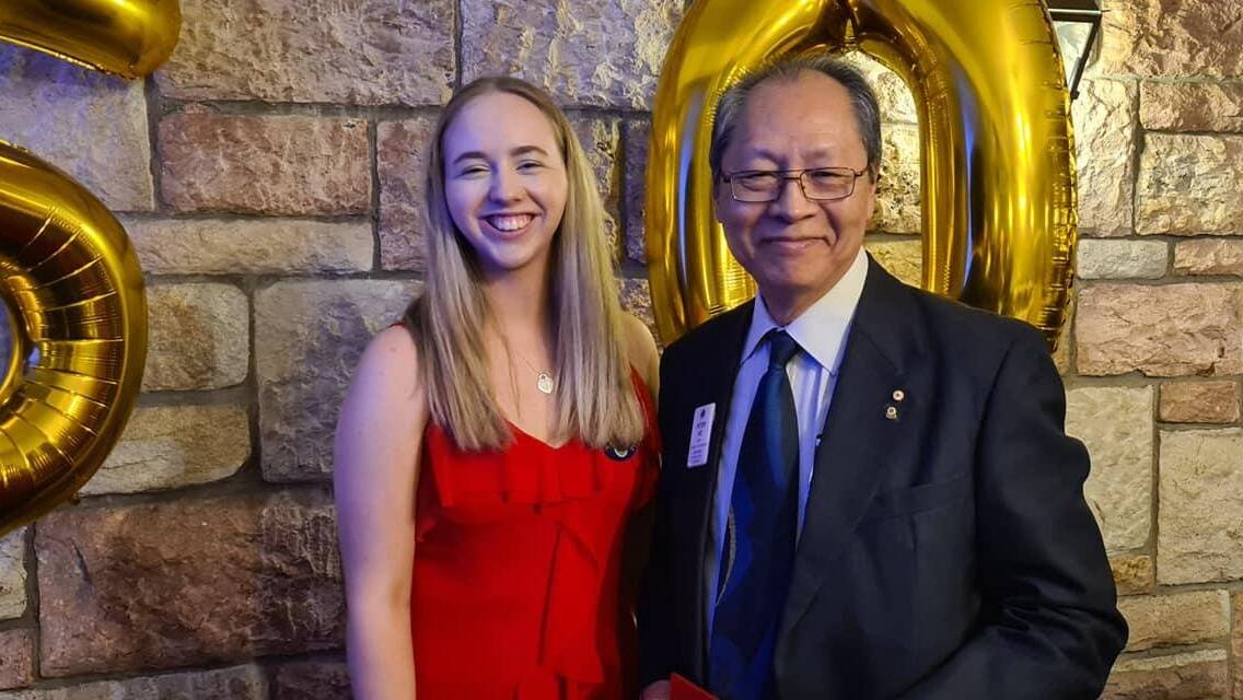 Emcee for the evening was Past District Governor Peter Ho with the club's youngest member Sophie who joined Capalaba after four years as a Leo in high school.

