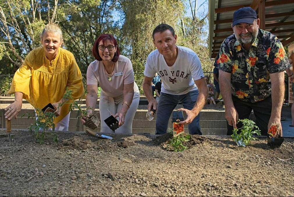DIG IT: Redlands mayor Karen Williams, deputy mayor Julie Talty, Bowman MP Andrew Laming and Cr Mark Edwards get their hands dirty in the gardens. Photos: Tristan Davies