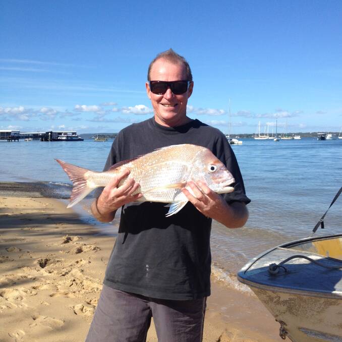 Happy fisherman: Tim Herse with a 65cm snapper caught using prawns for bait off  Macleay Island in southern Moreton Bay. Photo: Supplied