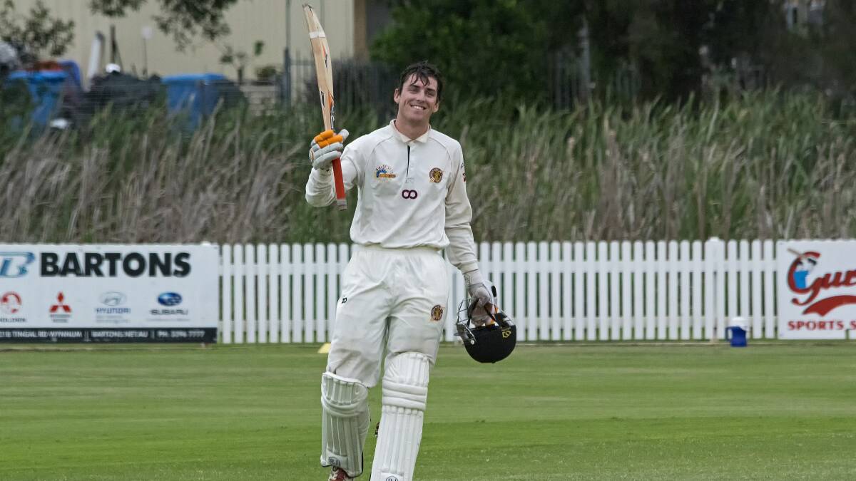 An innings to remember: Stuart Edgar raises his bat after completing his century for Redlands first grade side on the weekend. Photo: Doug O'Neill