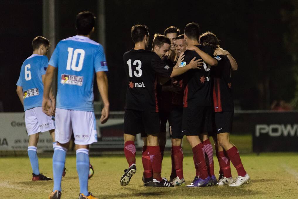 Teammates: Redlands United players celebrate a goal during the 2017 season. 