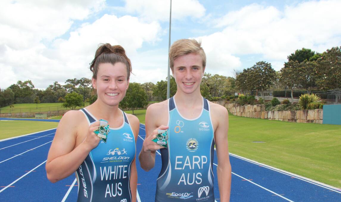 Medal winners: Sheldon Triathlon Club members Annabel White and Shaun Earp with their medals from the Noosa Triathlon. Photo: Supplied
